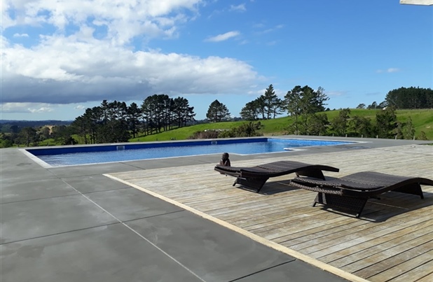 Swimming pool in Northland Countryside with large wooden deck