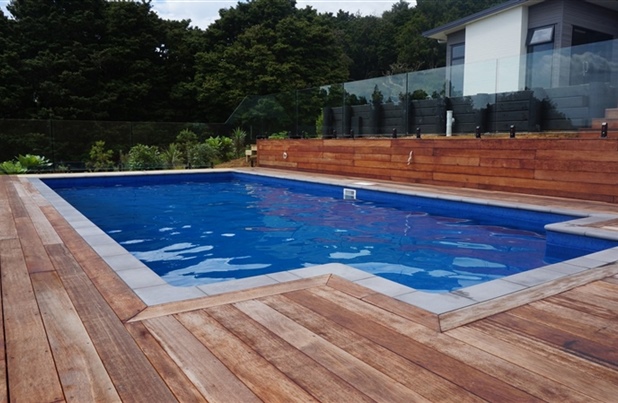 custom built above ground pool with wooden decking