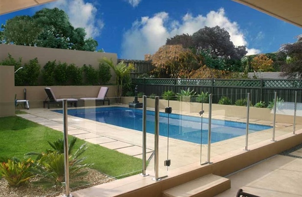 inground pool with glass fencing